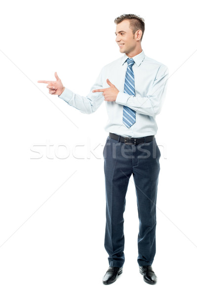 Young businessman pointing copyspace Stock photo © stockyimages