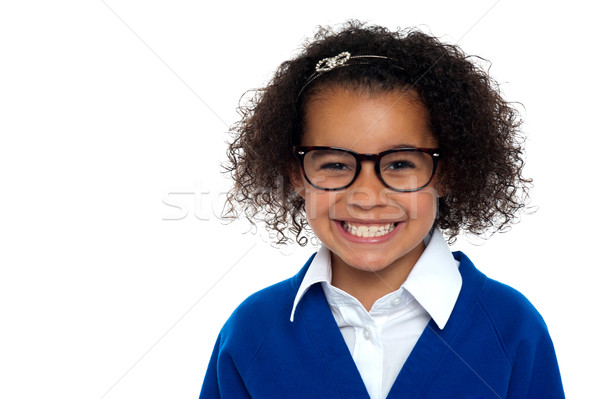 Bespectacled primary girl on a white background Stock photo © stockyimages