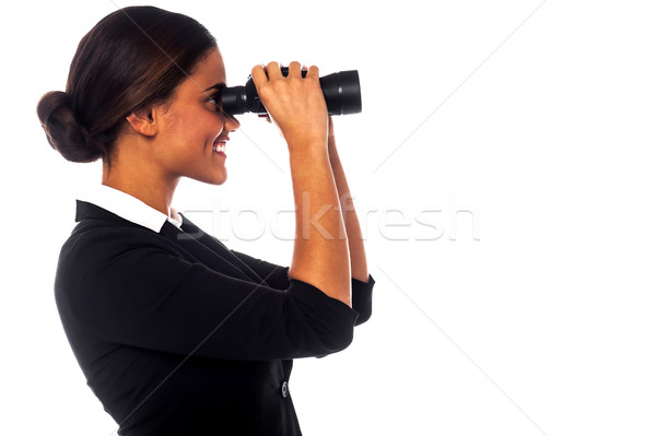 Corporate woman viewing through binoculars Stock photo © stockyimages