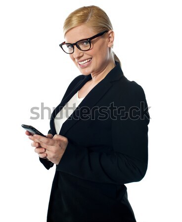 Saleswoman displaying latest mobile handset Stock photo © stockyimages