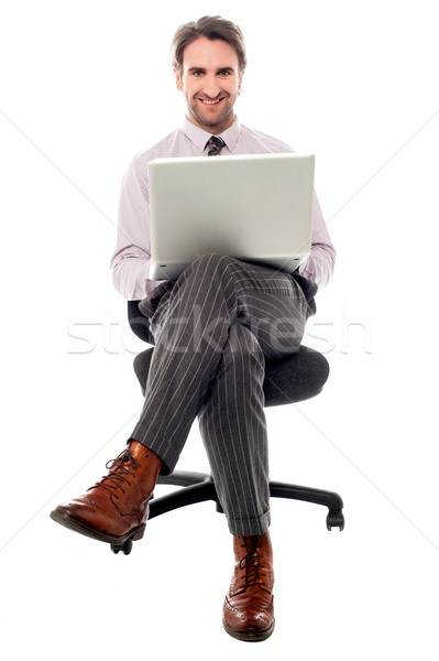 Corporate guy Geschäftsmann Sitzung Stuhl Laptop Stock foto © stockyimages