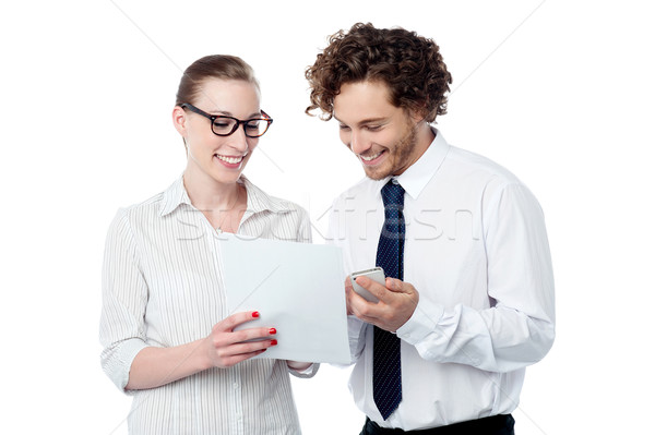 Colleagues reviewing business document Stock photo © stockyimages