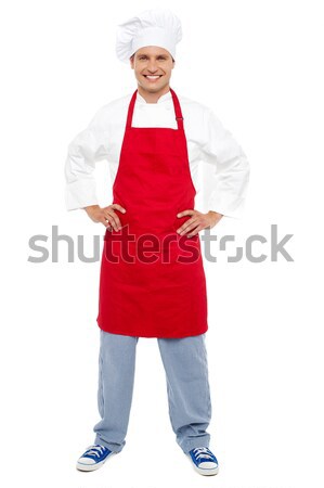 Relaxed chef standing with hands on his waist Stock photo © stockyimages