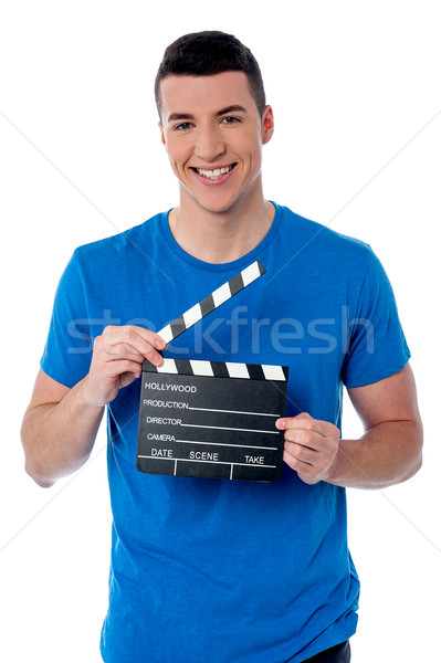 Smart guy holding clapperboard Stock photo © stockyimages