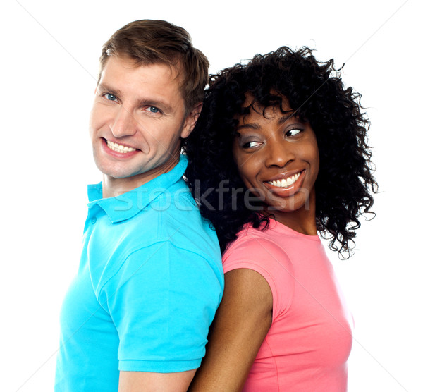 Stock photo: Closeup shot of young couple. Back to back