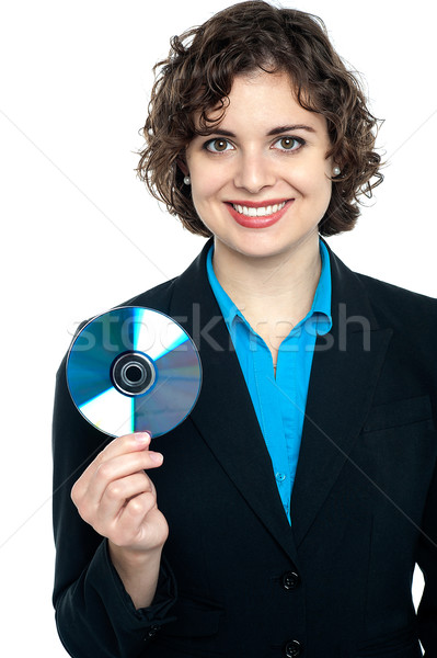 Charming corporate lady holding data disc Stock photo © stockyimages