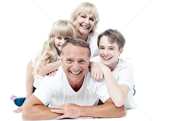 Stock photo: Cheerful family of four isolated on white