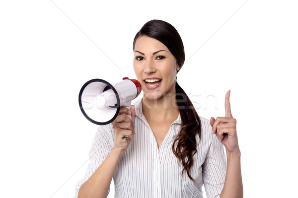 Happy woman posing with megaphone Stock photo © stockyimages