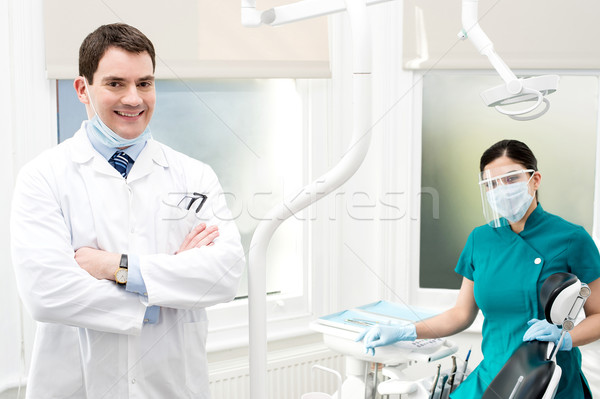 Male dentist with female assistant Stock photo © stockyimages