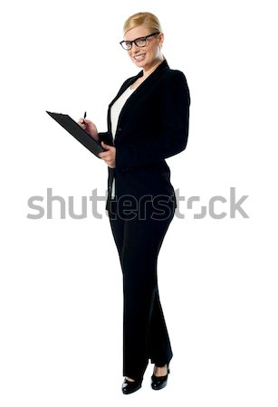 Businesswoman with a clipboard Stock photo © stockyimages