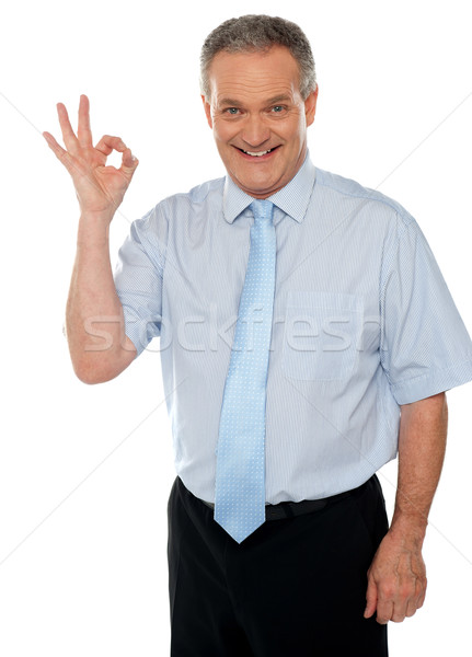 Cheerful male executive showing okay sign Stock photo © stockyimages