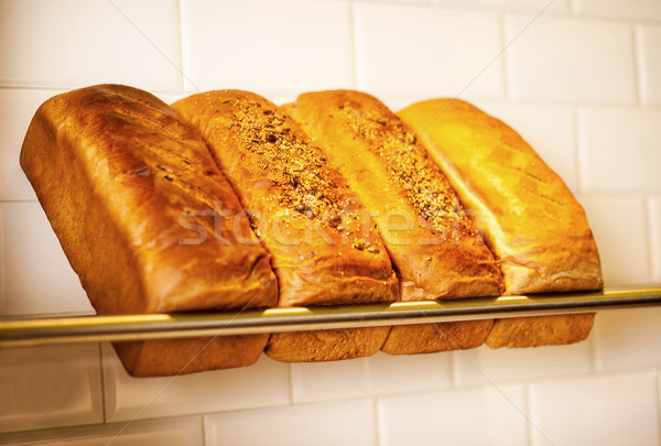 Freshly kneaded grain and white breads for sale Stock photo © stockyimages