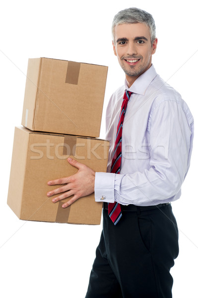 Corporate man with a cardboard box in hand Stock photo © stockyimages