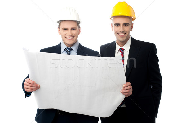 [[stock_photo]]: Civile · ingénieurs · construction · plan · souriant