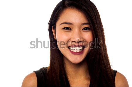 Pretty smiling girl in black top Stock photo © stockyimages