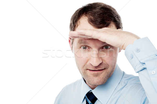 Corporate guy watching something closely Stock photo © stockyimages