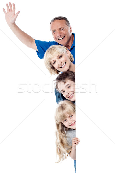 радостный семьи четыре за улыбаясь Сток-фото © stockyimages