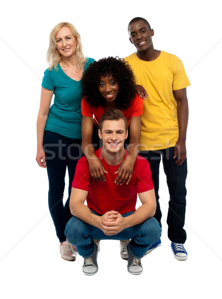 группа четыре счастливым молодые люди колледжей позируют Сток-фото © stockyimages