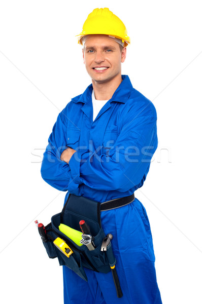 Young contractor with tool set and arms crossed Stock photo © stockyimages