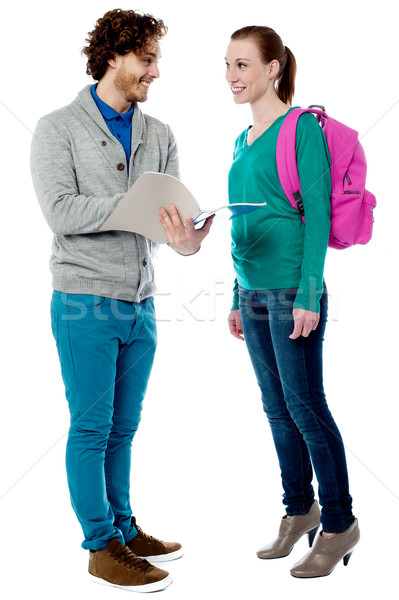 College friends discussing lecture notes Stock photo © stockyimages