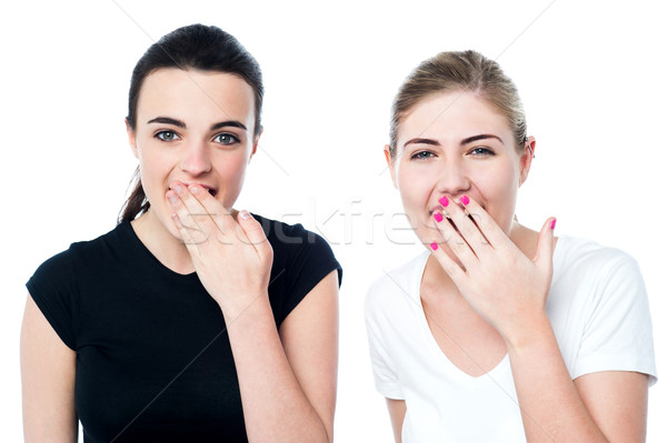 Surprised young girls laughing out loud Stock photo © stockyimages