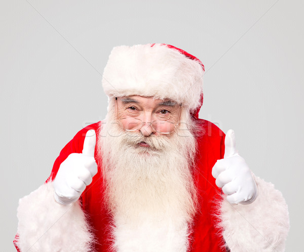 Happy santa clause with thumbs up Stock photo © stockyimages