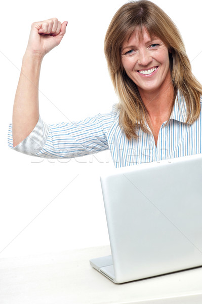 Excited businesswoman celebrating her success Stock photo © stockyimages