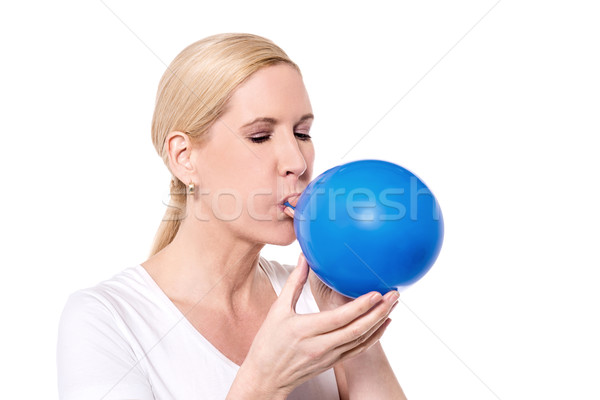 It's hard blowing a balloon.  Stock photo © stockyimages