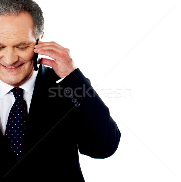 Business professional communicating via phone Stock photo © stockyimages