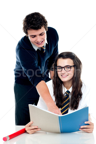 Young boy helping his friend and guiding Stock photo © stockyimages