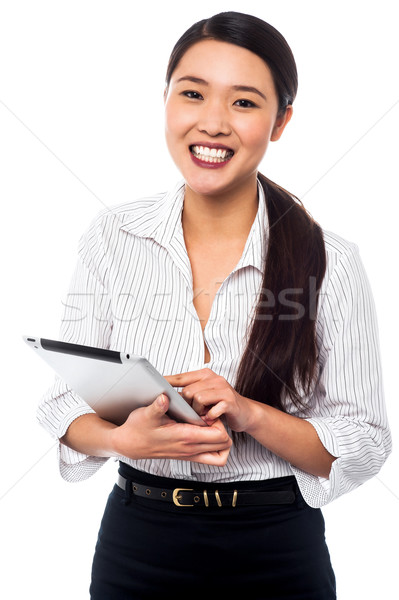 Corporate woman browsing on tablet pc Stock photo © stockyimages