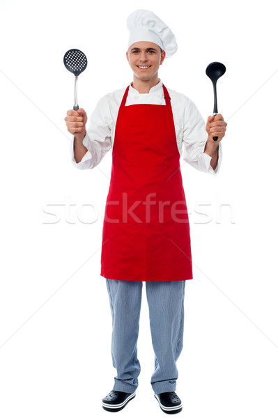 Chef holding kitchen essentials Stock photo © stockyimages