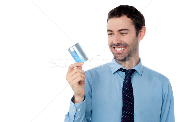 Cheerful businessman holding credit card Stock photo © stockyimages