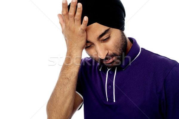 Young man having severe headache Stock photo © stockyimages