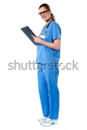 Full length portrait of a lady doctor Stock photo © stockyimages