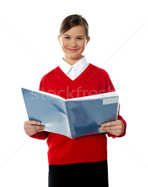 Bájos iskolás gyerek olvas könyv kéz a kézben néz Stock fotó © stockyimages