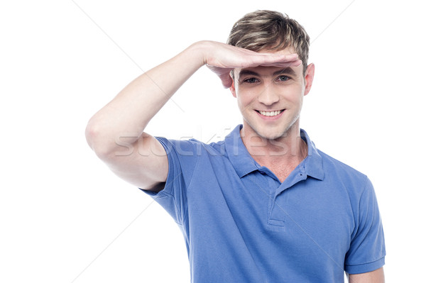 Cheerful man looks into the distance Stock photo © stockyimages