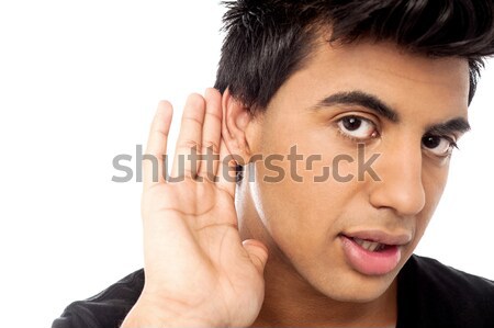Casual young guy eavesdropping  Stock photo © stockyimages
