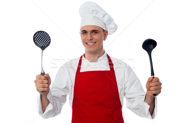 Male chef holding kitchen essentials Stock photo © stockyimages