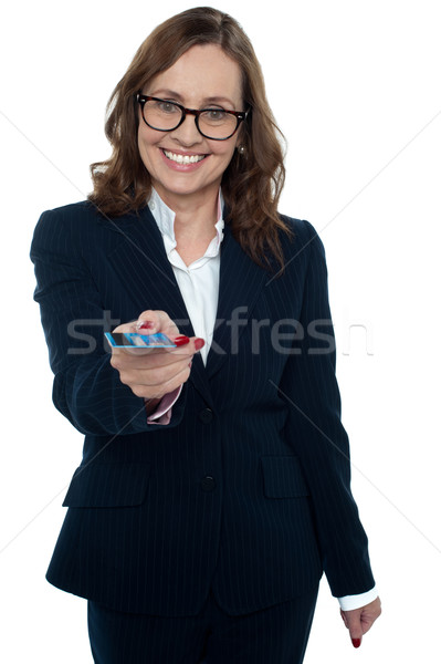 Business executive offering you a credit card Stock photo © stockyimages