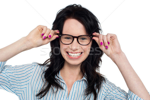 Joyous woman holding her spectacles Stock photo © stockyimages