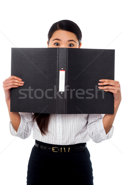 Donna nascondere faccia business file femminile Foto d'archivio © stockyimages