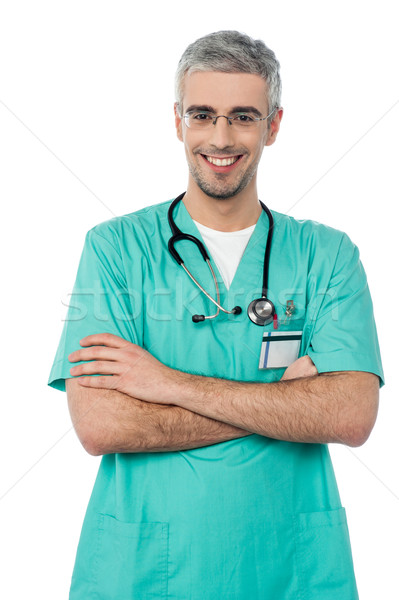 улыбаясь врач стетоскоп Постоянный оружия сложенный Сток-фото © stockyimages