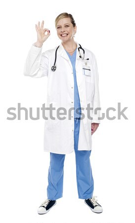 Female medical specialist gesturing ok sign Stock photo © stockyimages
