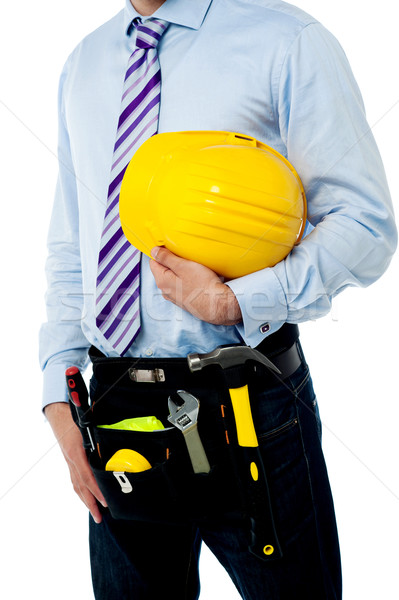 Cropped image of a man with safety helmet Stock photo © stockyimages