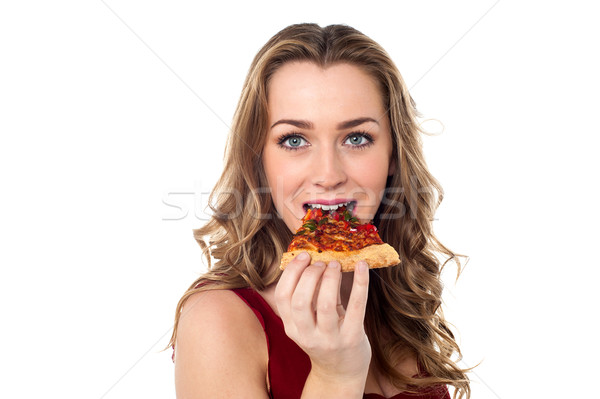 Jonge vrouwelijke pizza aantrekkelijk pizza slice Stockfoto © stockyimages