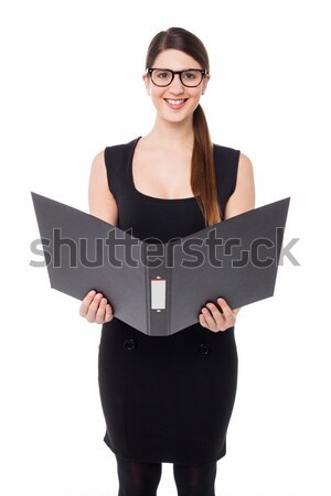 Business lady reviewing file she is holding Stock photo © stockyimages