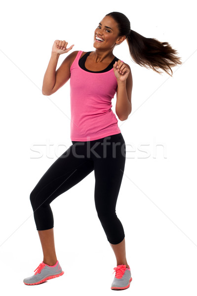 Excited young female fitness trainer Stock photo © stockyimages