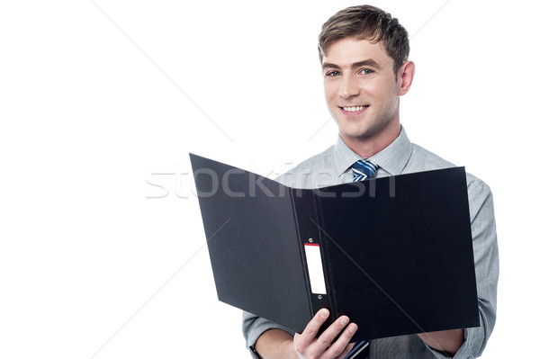 Smiling businessman holding the folder  Stock photo © stockyimages