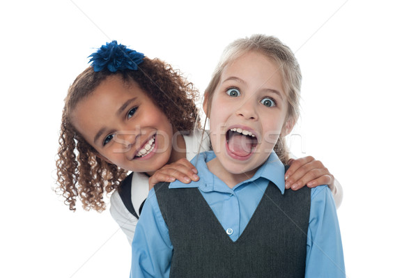 Joyous school girls playing Stock photo © stockyimages